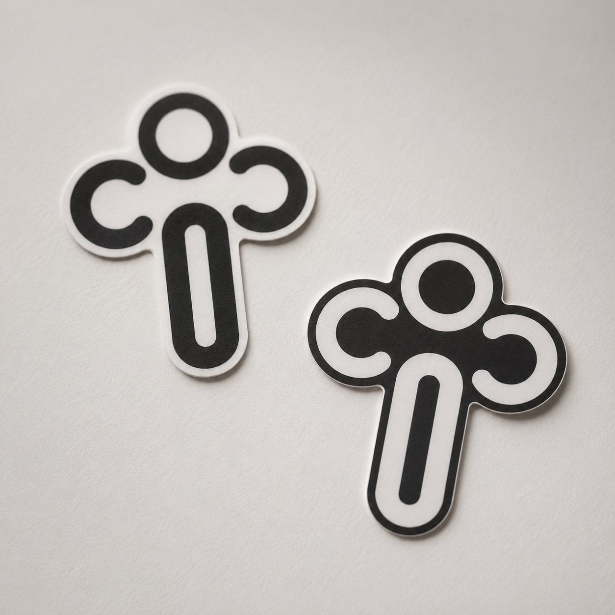CiC cross logo stickers in black and white colorways